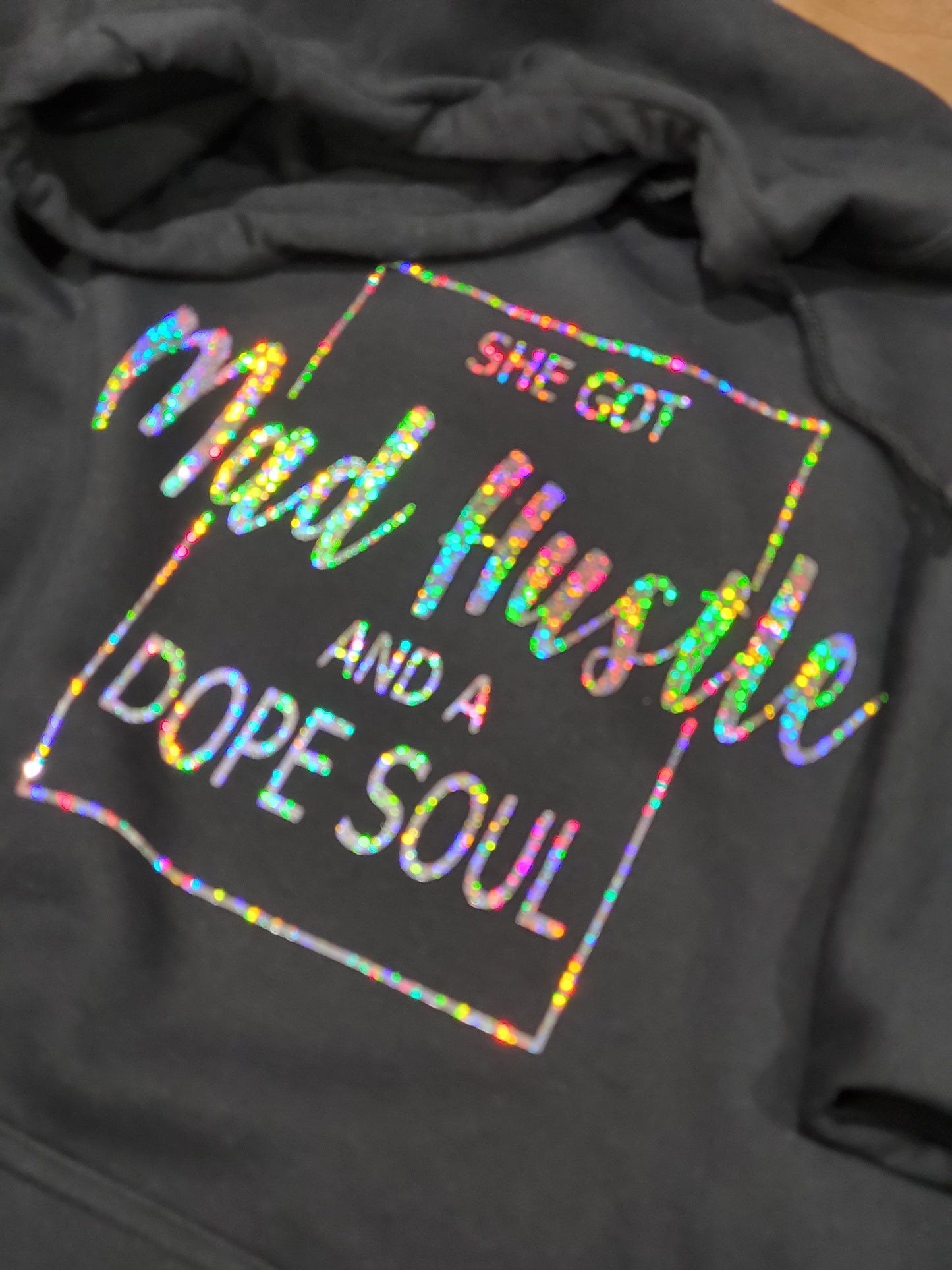 She got mad hustle Tee